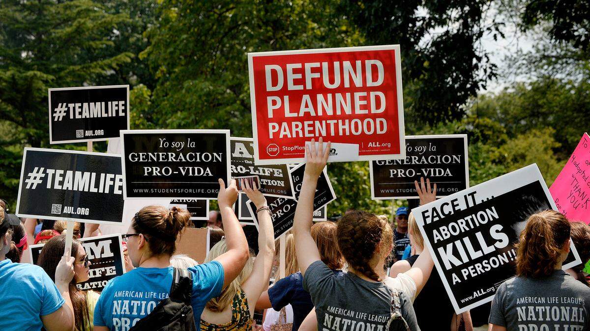 Anti-abortion activists hold a rally opposing federal funding for Planned Parenthood in front of the U.S. Capitol in 2015 in Washington, D.C.