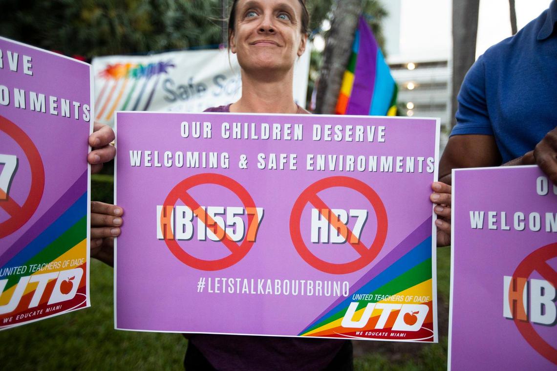 Jessica Lowther holds sign during the Safe Schools South Florida rally against the ‘Don’t Say Gay’ bill at Pride Park in Miami Beach on March 1, 2022.