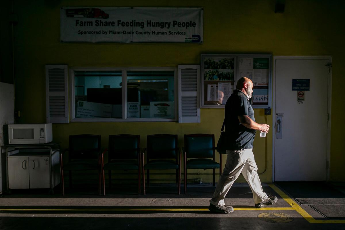 John Delgado, 52, the assistant operations manager at Farm Share, finally heads home from the warehouse in Homestead. He works late most nights to avoid the temperamental weather that awaits him in his backyard.