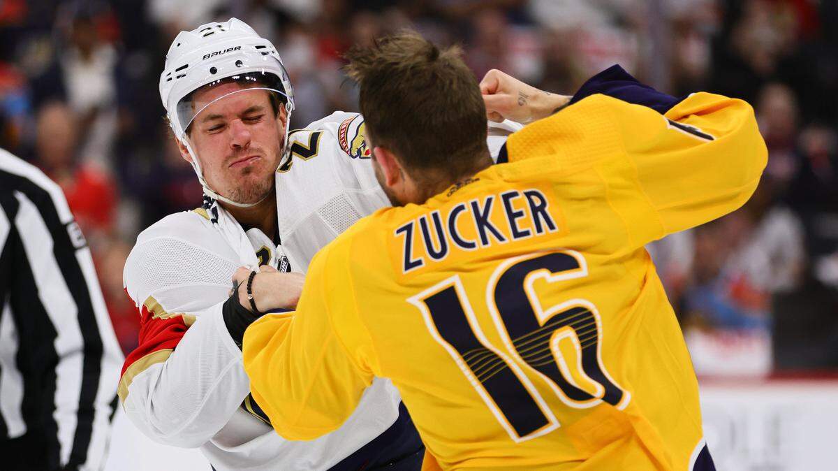 Mar 21, 2024; Sunrise, Florida, USA; Nashville Predators left wing Jason Zucker (16) and Florida Panthers center Nick Cousins (21) fight during the first period at Amerant Bank Arena.