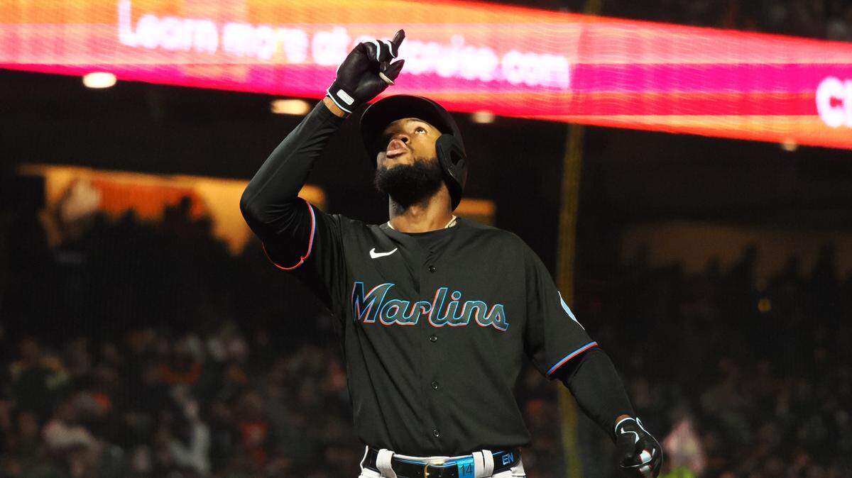 Miami Marlins left fielder Bryan De La Cruz (14) celebrates at home plate after hitting a solo home run against the San Francisco Giants during the eighth inning at Oracle Park on Friday, May 19, 2023.