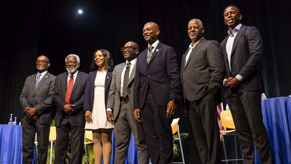 From left to right: Former Miami-Dade commissioner Jean Monestime, African Heritage Cultural Arts Center Managing Director Marshall L. Davis Sr., Te Mayonna Brown, Florida State Senator Shevrin Jones, Miami-Dade commissioner Oliver Gilbert, Miami Criminal Defense Attorney Roderick Darrell Vereen and Kendrick Meek Jr. gather for a group photo after participating in a town hall debate ahead of the U.S. House Florida District 24 race at Florida Memorial University on Tuesday, June 30, 2026, in Miami Gardens, Fla.