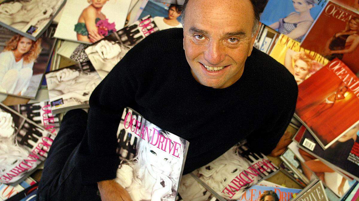 Ocean Drive Magazine publisher Jerry Powers surrounded by old issues of the magazine.