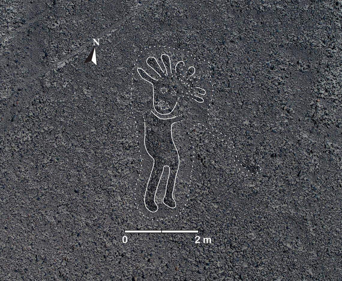 A geoglyph of a human figure. Researchers digitally digitally added white lines to highlight the shape.