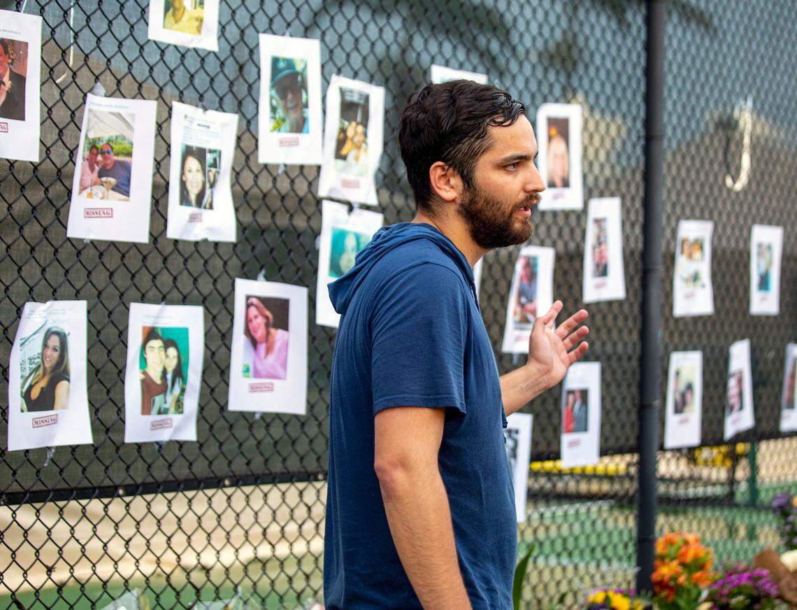 Leo Soto, 26, a former high school classmate of missing person, Nicky Langesfeld, speaks with the media about how he erected a make-shift memorial for people to gather and pray at, for the missing people near the site of the partially collapsed Champlain Towers South Condo in the Surfside community of Miami Beach, Florida, on Friday, June 25, 2021. The 12-story oceanfront condo tower at 8777 Collins Ave. crumpled just after 1:30 a.m., on Thursday June 24, trapping an unknown number of residents asleep in their beds inside the wreckage.
