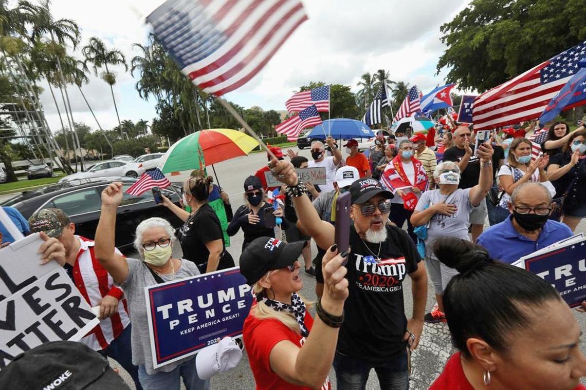 Demonstrators and President Donald Trump supporters rally at 8000 NW 154th St. in Miami Lakes, Fl, on June 14, 2020.