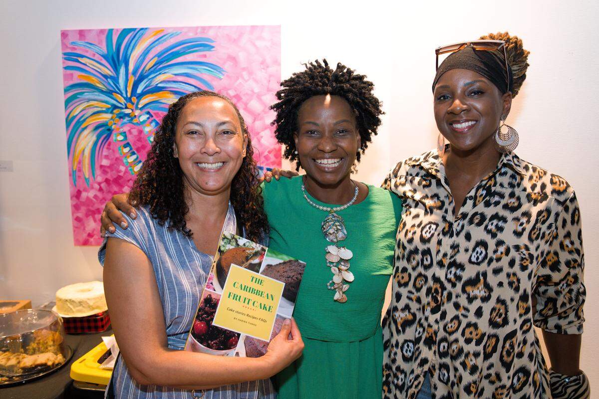 A raffle prize winner with Finiana Joseph of Caribbean Professionals Network and Calibe Thompson, the co-founder and executive director of Island SPACE Caribbean Museum at the Rum Cake and Caribbean Black Cake Fest.