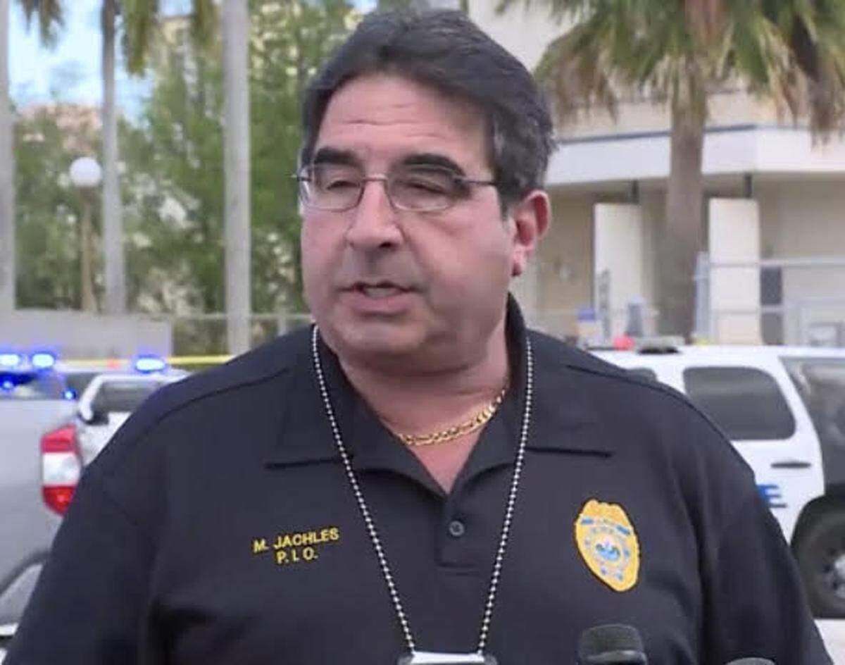 West Palm Beach Police spokesmand Michael Jachles briefs reporters on a man shot by police after they said he crashed his van through the gates of the Alexander W. Dreyfoos School of the Arts Friday, May 13, 2022.