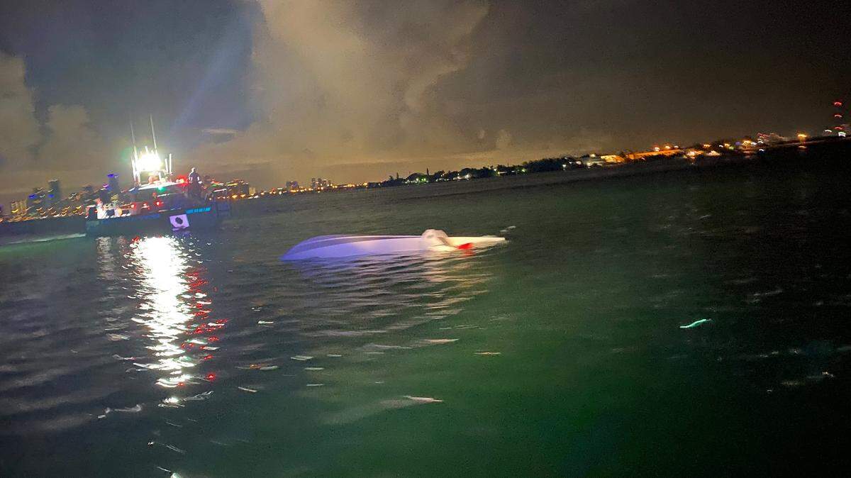 Two men were rescued by a Coast Guard Station Miami Beach crew after their boat capsized around 4:15 a.m. Aug. 6, 2021, in Biscayne Bay near the Miami Seaquarium.