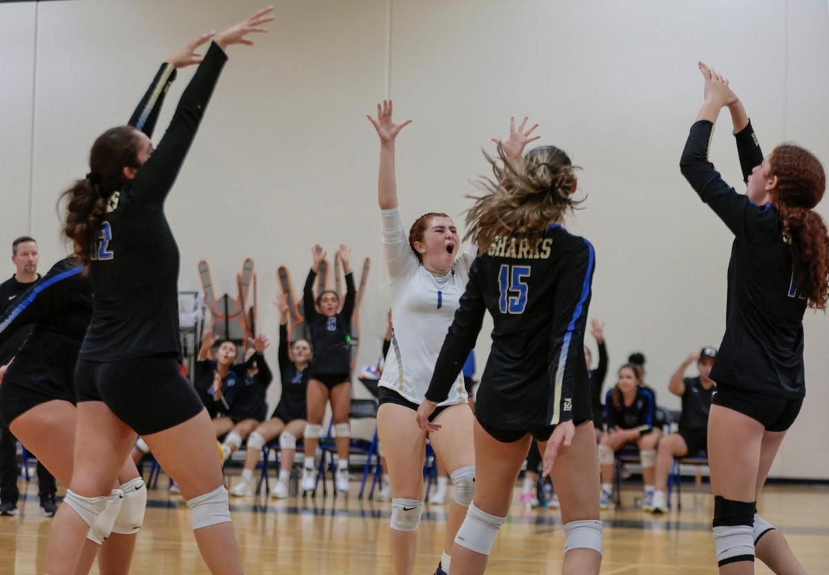 Devine Savior’s Isabella Aragon (1) reacts with teammates after they win a point during match against Chaminade-Madonna in volleyball playoff at Divine Savior Academy on Friday, October 28, 2022.