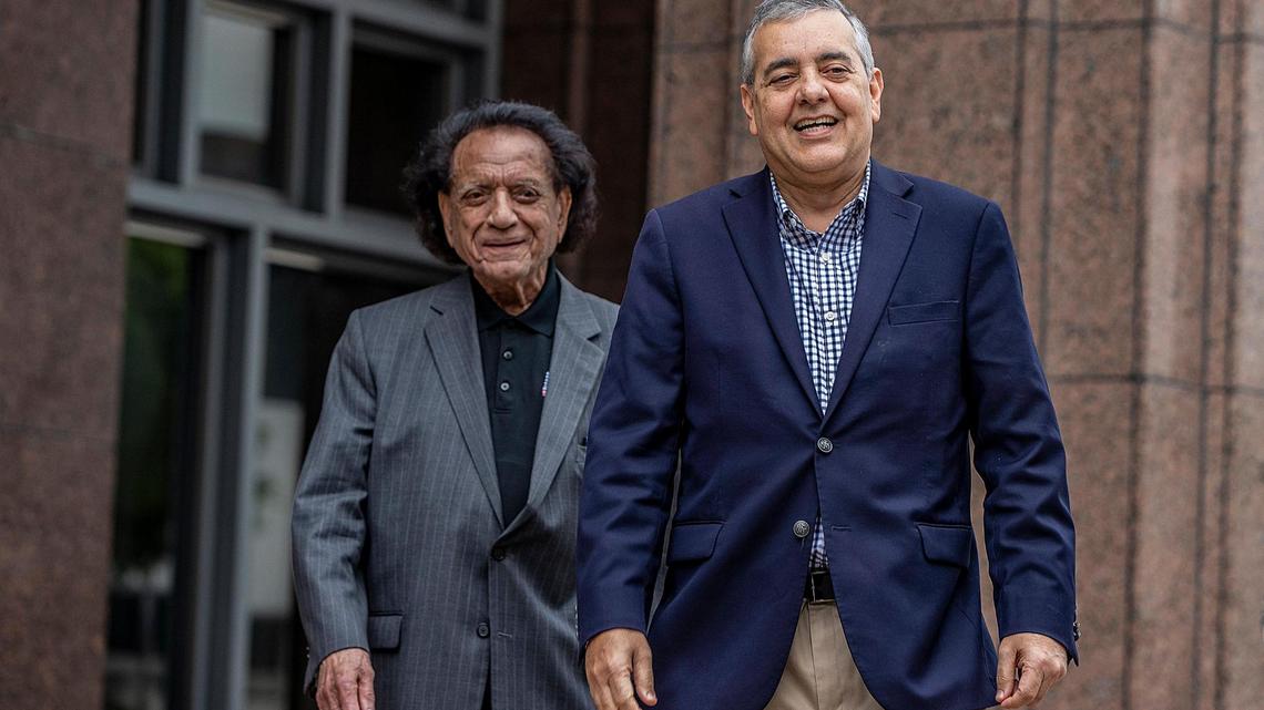 Former U.S. Rep. David Rivera (right) walks out of court with his supporter Luis Conte Aguero after his first federal court appearance before Magistrate Judge Jonathan Goodman at the James Lawrence King Criminal Justice Building in Miami, on Tuesday, Dec. 20, 2022.
