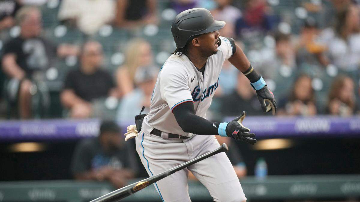 Miami Marlins’ Lewis Brinson breaks from the batter’s box after connecting for a single off Colorado Rockies starting pitcher Austin Gomber during the fourth inning of a baseball game Saturday, Aug. 7, 2021, in Denver.
