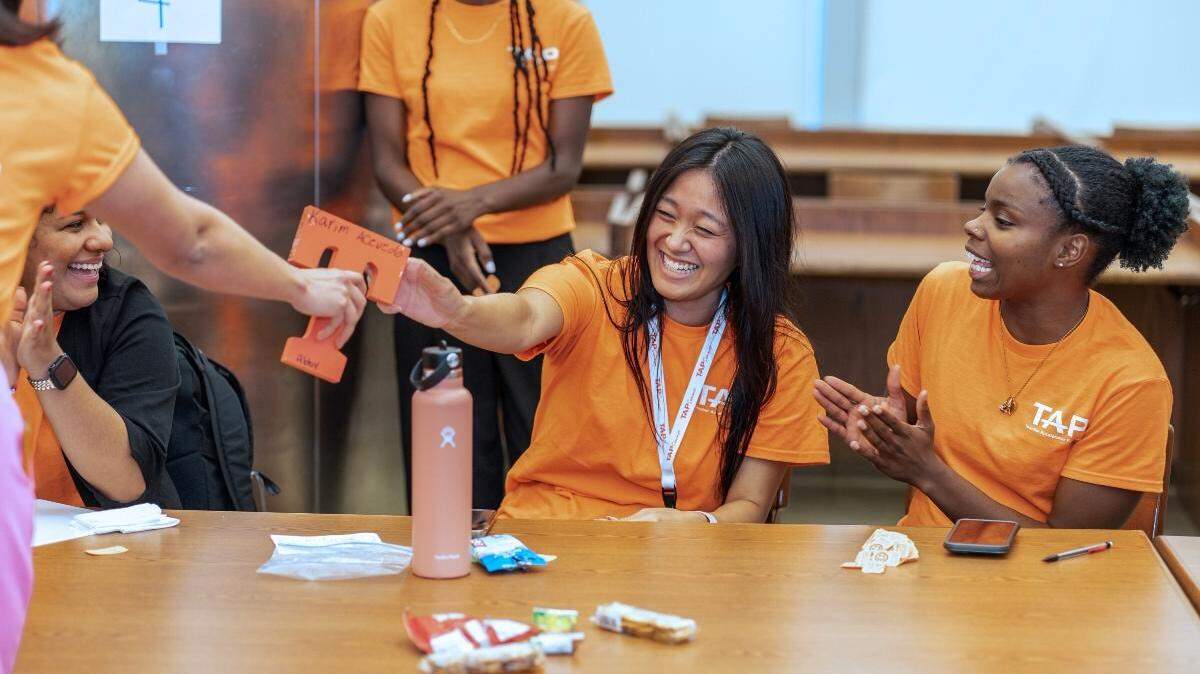 Today, Selena Wang (center) is a chemistry teacher at Miami Jackson Senior High, but that wasn’t her plan until she joined Miami’s Teacher Accelerator Program (TAP).