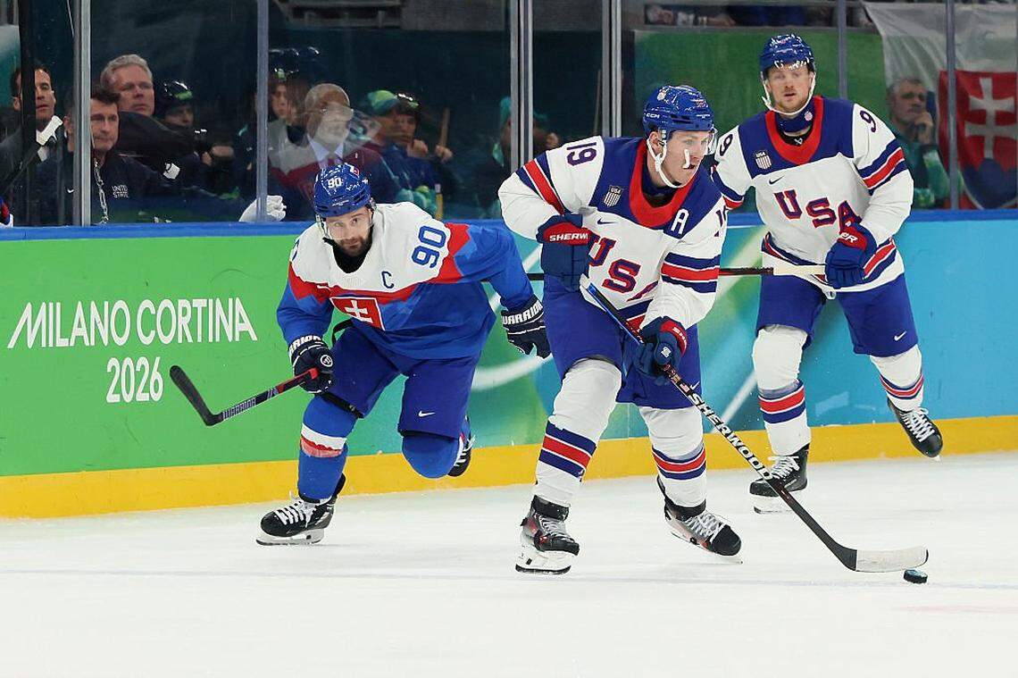 MILAN, ITALY - FEBRUARY 20: Matthew Tkachuk #19 of Team United States skates with the puck against Tomas Tatar #90 of Team Slovakia in the third period during the Men's Semifinals Playoff match between the United States and Slovakia on day fourteen of the Milano Cortina 2026 Winter Olympic games at Milano Santagiulia Ice Hockey Arena on February 20, 2026 in Milan, Italy. (Photo by Bruce Bennett/Getty Images)
