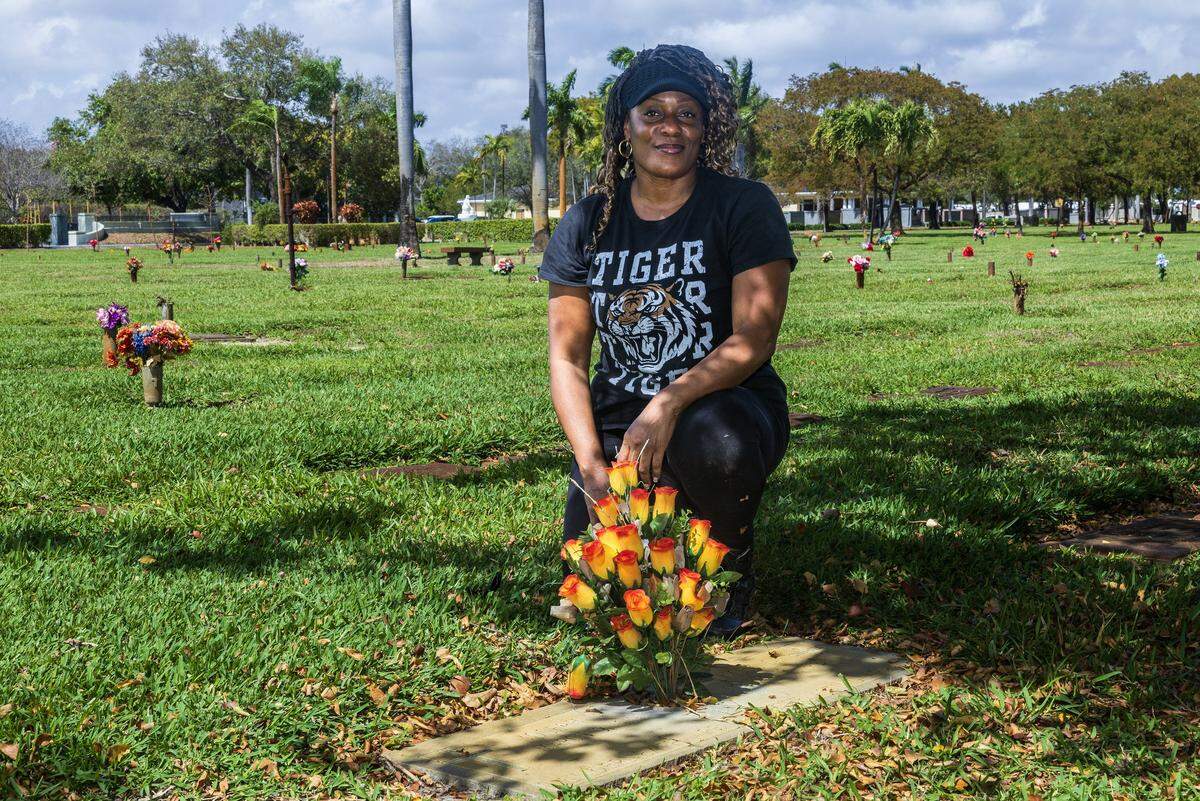 Tracie Boyd posed by the grave of Blanche and Joseph Ely, who were a couple of African American educators pioneers in Broward County, at the Forest Lawn Memorial Gardens, that she have been restoring and keeping it clean after she discovered it while visiting her grandparents' grave since September 2025 after seeing their grave in disarray, on Thursday, March 05, 2026.
