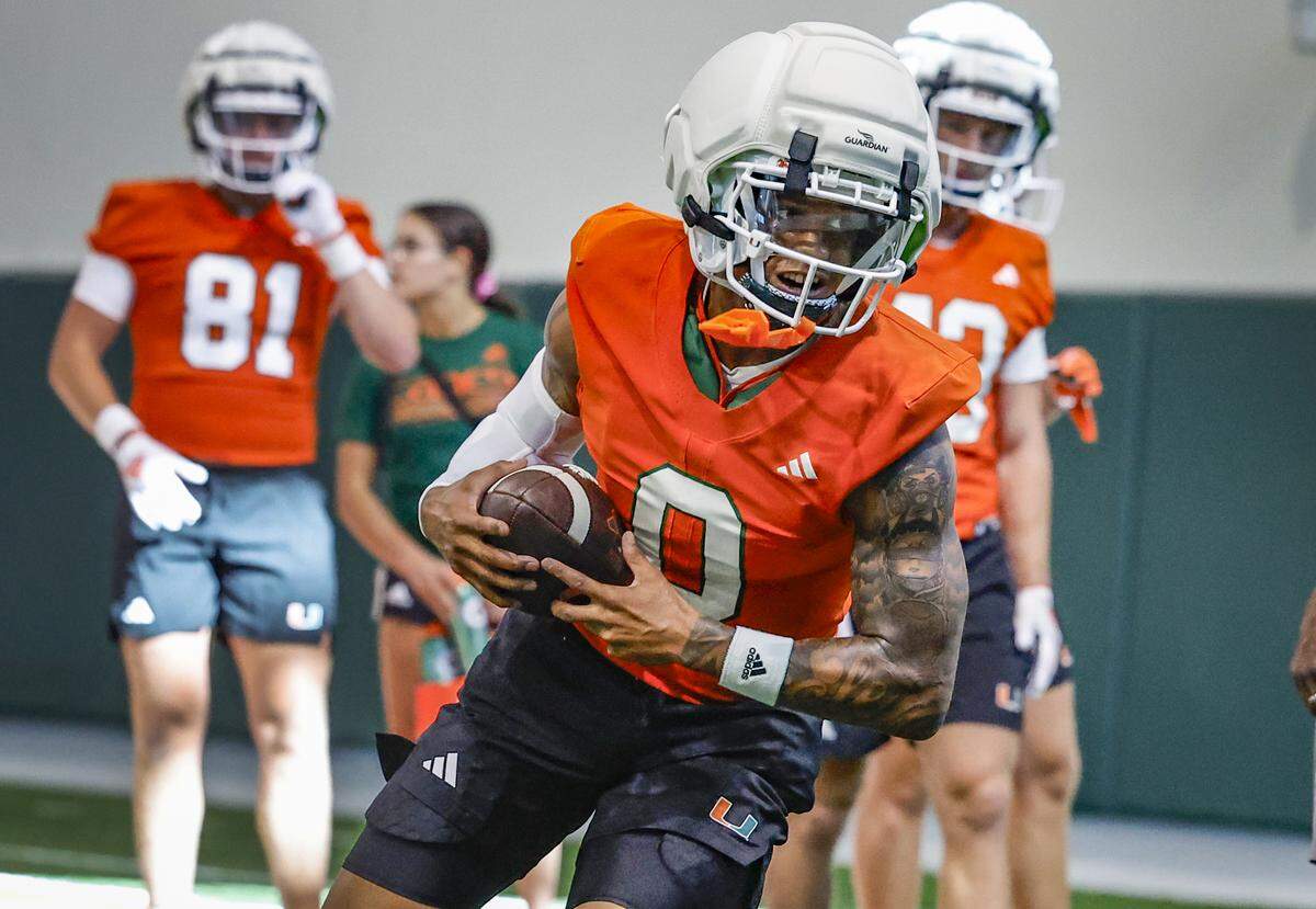 Miami Hurricanes wide receiver Keelan Marion 0) runs through practice drills with teammates at the Carol Soffer Indoor Practice Facility in Coral Gables, Florida, on Thursday, July 31, 2025.