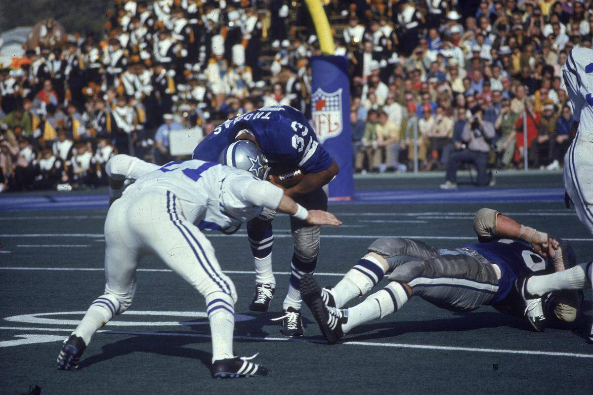 Dallas Cowboys running back Duane Thomas (33) puts his head down and runs into a Baltimore Colts defender on his way down the field during Sunday’s Super Bowl V in Miami on January 18, 1971.