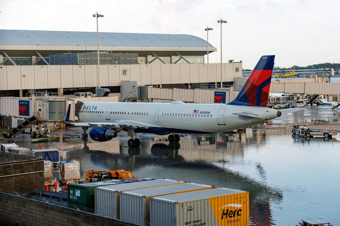 A Delta Air Lines jet at the terminal as the runway remains flooded from heavy rain at Fort Lauderdale-Hollywood International Airport on Thursday, April 13, 2023.
