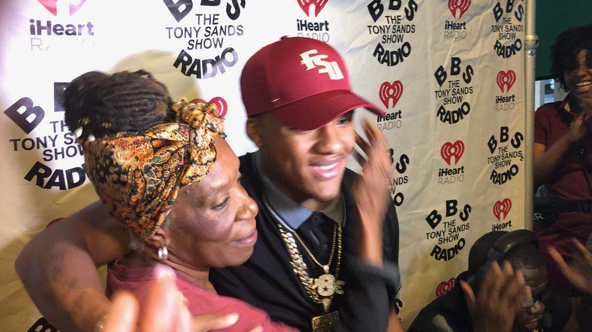 Deerfield Beach senior all-purpose running back Jaylan Knighton commits to Florida State with his grandmother at his side on Tuesday at Duffy’s Sport Bar and Grill.