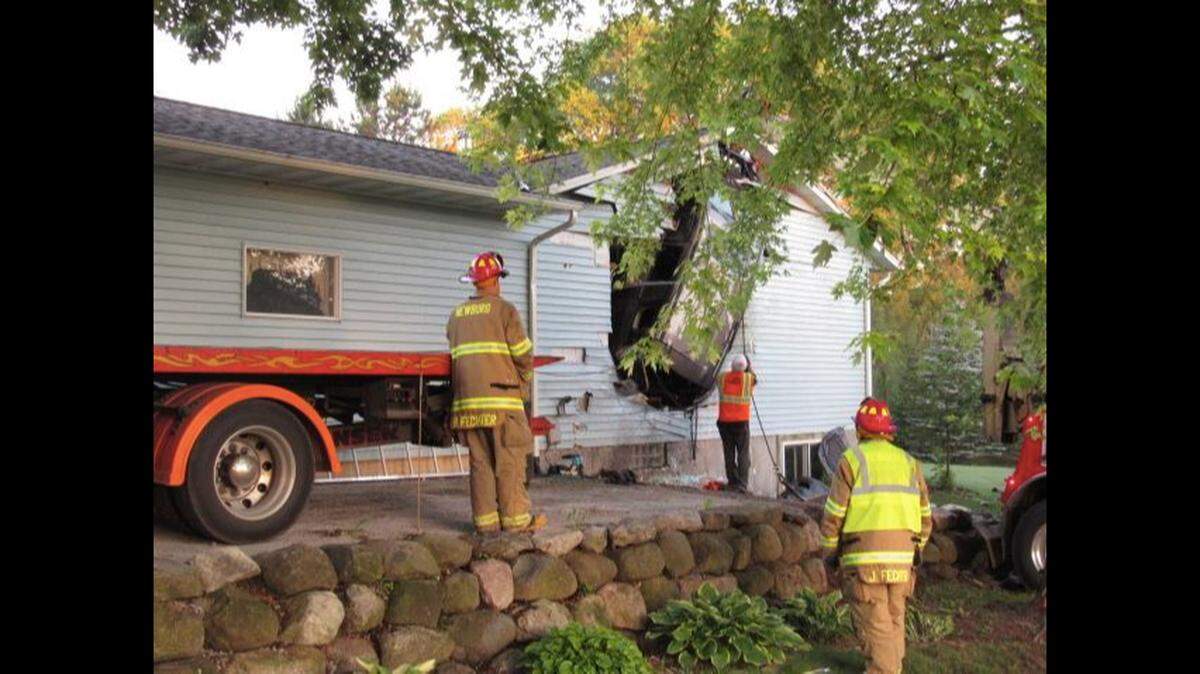 The fire department says a towing company helped remove the car from the home.