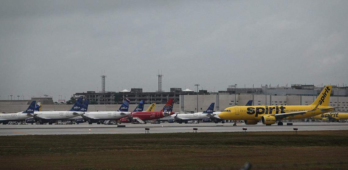 A Spirit Airlines jet taxis past a line of grounded JetBlue planes, Sunday, Jan 20, 2019, at Fort Lauderdale Hollywood International Airport. A winter storm on the east coast caused the delay or cancellation of dozens of flights to Newark, LaGuardia, JFK, and Philafdelphia. (Joe Cavaretta / South Florida Sun Sentinel) ...SOUTH FLORIDA OUT; NO MAGS; NO SALES; NO INTERNET; NO TV...
