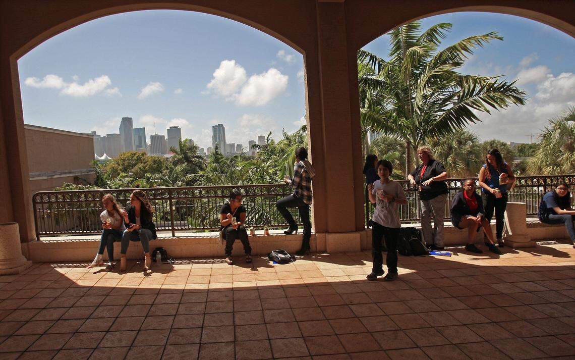 Students take a break after the written spelling exam to warm-up in the South Florida sun. Middle school students competed in the Miami-Dade/Monroe Spelling Bee at Jungle Island on Wednesday, March 11, 2015.