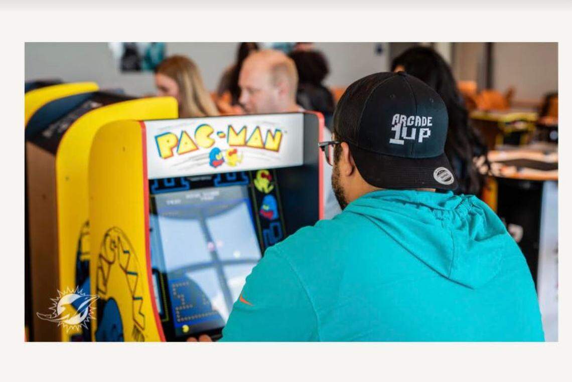 A gamer at Arcade1Up Game Lounge at Hard Rock Stadium in Miami Gardens