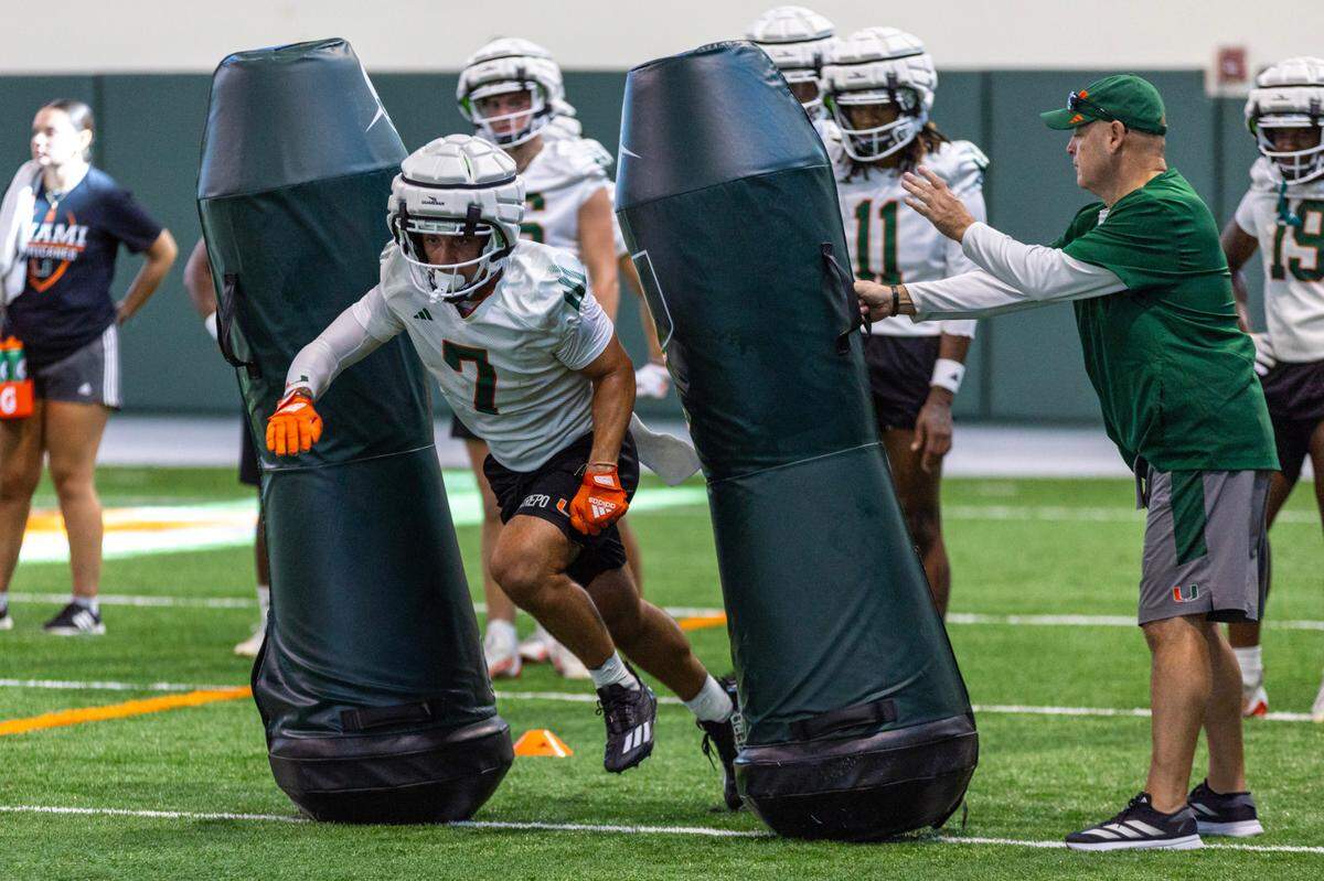 Miami Hurricanes wide receiver Xavier Restrepo (7) runs drills during practice at the Carol Soffer Indoor Practice Facility on Thursday, August 1, 2024, in Coral Gables, Fla.