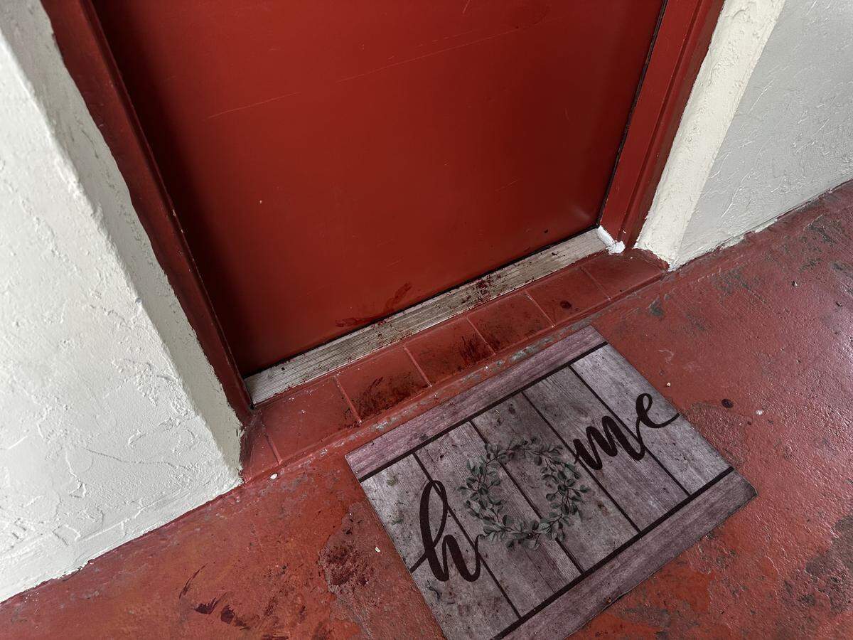 Blood left behind on the doorstep of apartment 408 after Stephen McKenzie shot and killed Julie Cruz, 32, and their two children Nova and Emery McKenzie, both 2 years old, at an apartment complex in Pembroke Park, near Hallandale Beach. Cruz’s two other children were shot, one of whom was killed.