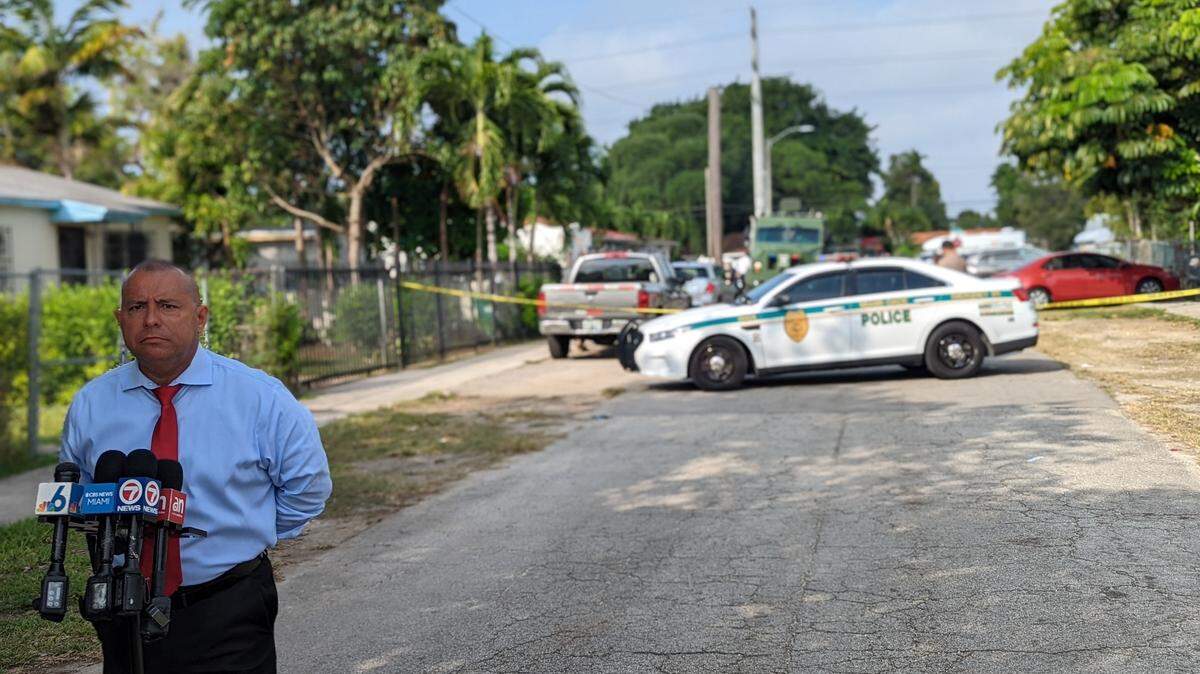 Miami-Dade police officers who had just entered a home with a search warrant, were fired on by a man in a bedroom with a woman and a baby, Miami-Dade Police Spokesman Alvaro Zabaleta said at the scene. No one was injured.