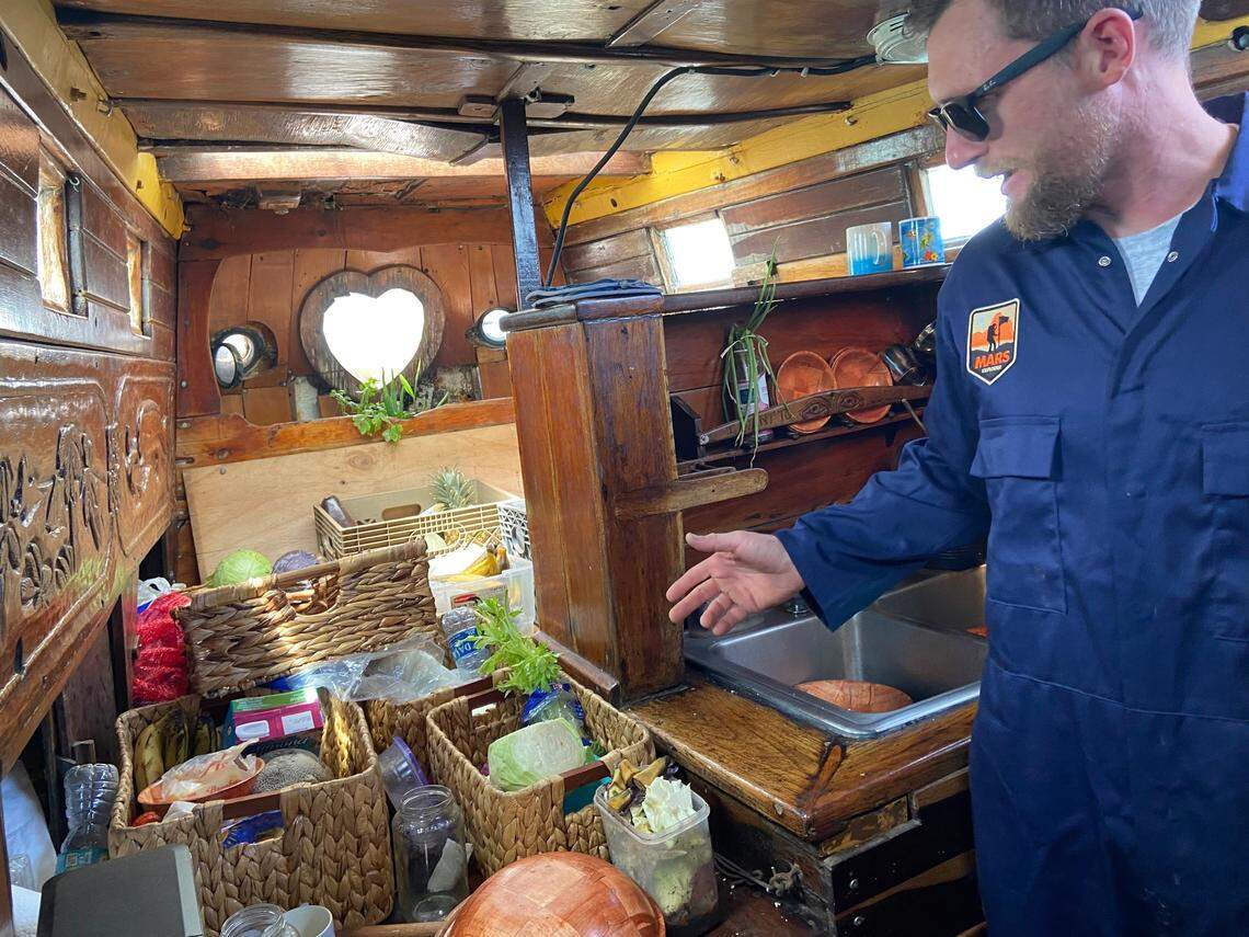 John Wolfe, captain of the Anne, a 70-foot schooner based near Wilmington, North Carolina, shows the vessel’s galley. 