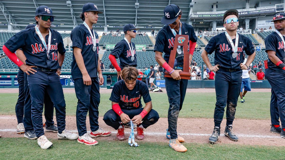 Miami Christian’s Ray Yero (10) reacts after the team is presented with runner up medals as teammate Fabio Peralta (17) holds the runner up trophy after the Victors lose to the St. Johns Spartans during the FHSAA Baseball Class 2A State Final at Hammond Stadium in Fort Myers, Florida on Wednesday, May 22, 2024.