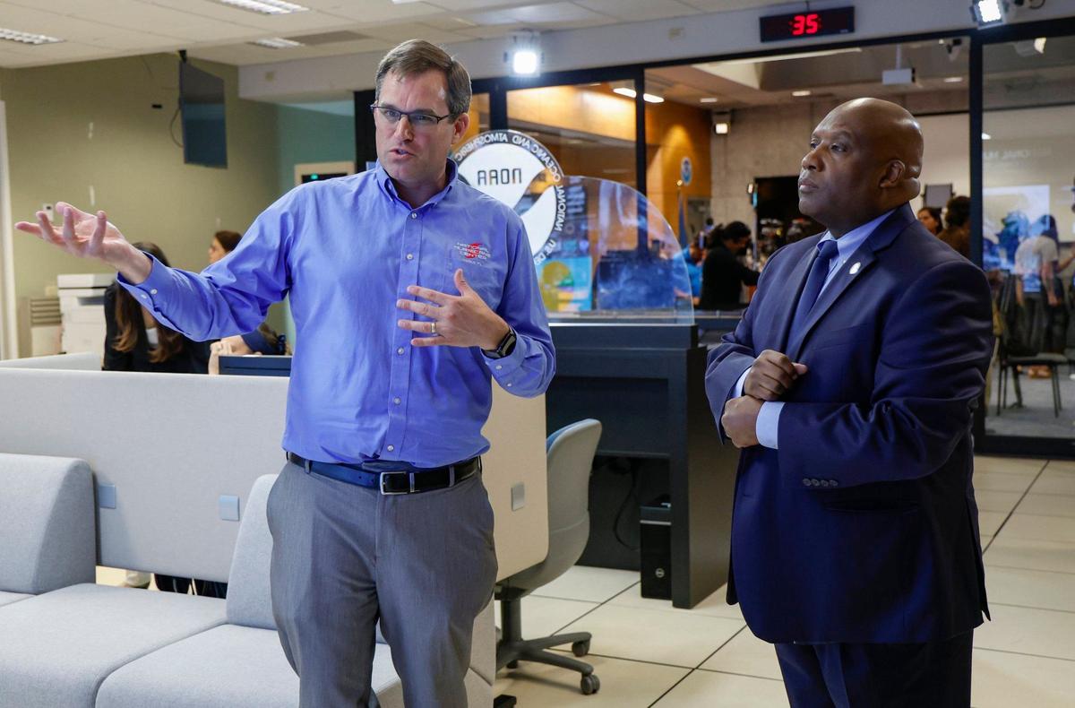 National Hurricane Center Director Michael Brennan speaks with FEMA Deputy Administrator Erik Hooks, after a press conference at the National Hurricane Center in Miami, Florida on Friday, May 31, 2024.