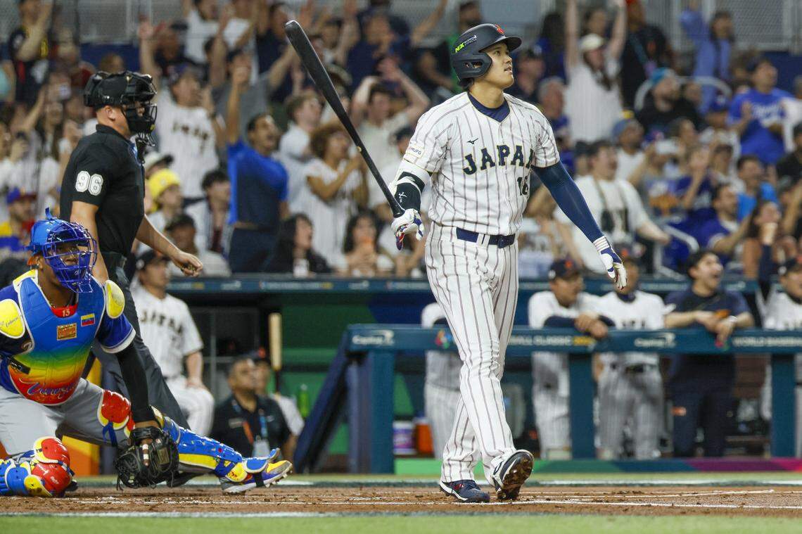 Japan designated hitter Shohei Ohtani (16) reacts after hitting a homerun in the first inning against Venezuela at the World Baseball Classic at loanDept park on Saturday, March 14, 2026.