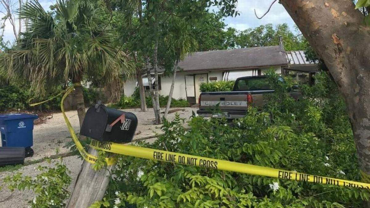 Yellow tape surrounds a house at 720 Ponce de Leon Blvd. in Key Largo where the body of 70-year-old Mary Bonneville was found Oct. 21, 2017, by Key Largo volunteer firefighters. Detectives believe she died before the fire based on stab wounds they found on her neck. 