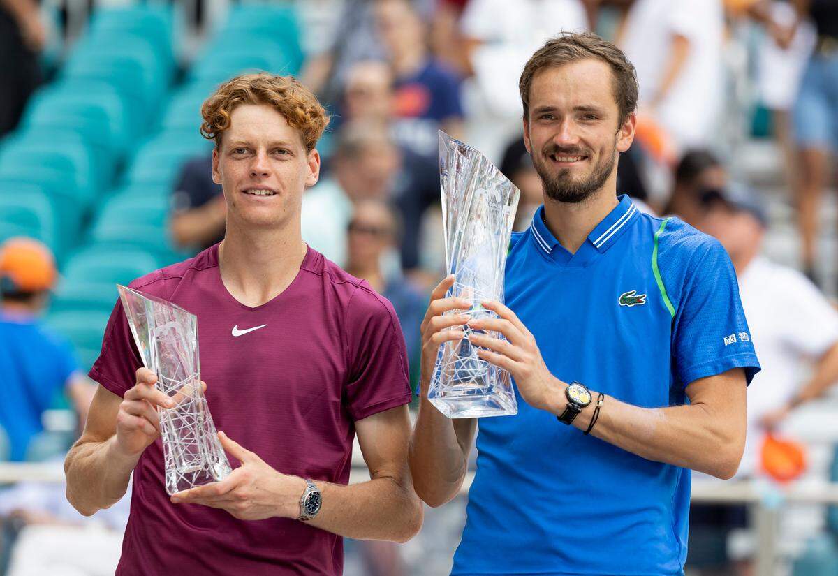 Daniil Medvedev of Russia, right, and Jannik Sinner of Italy hold their trophies after their Men’s Final in the Miami Open tennis tournament at Hard Rock Stadium on April 2, 2023, in Miami Gardens, Fla.