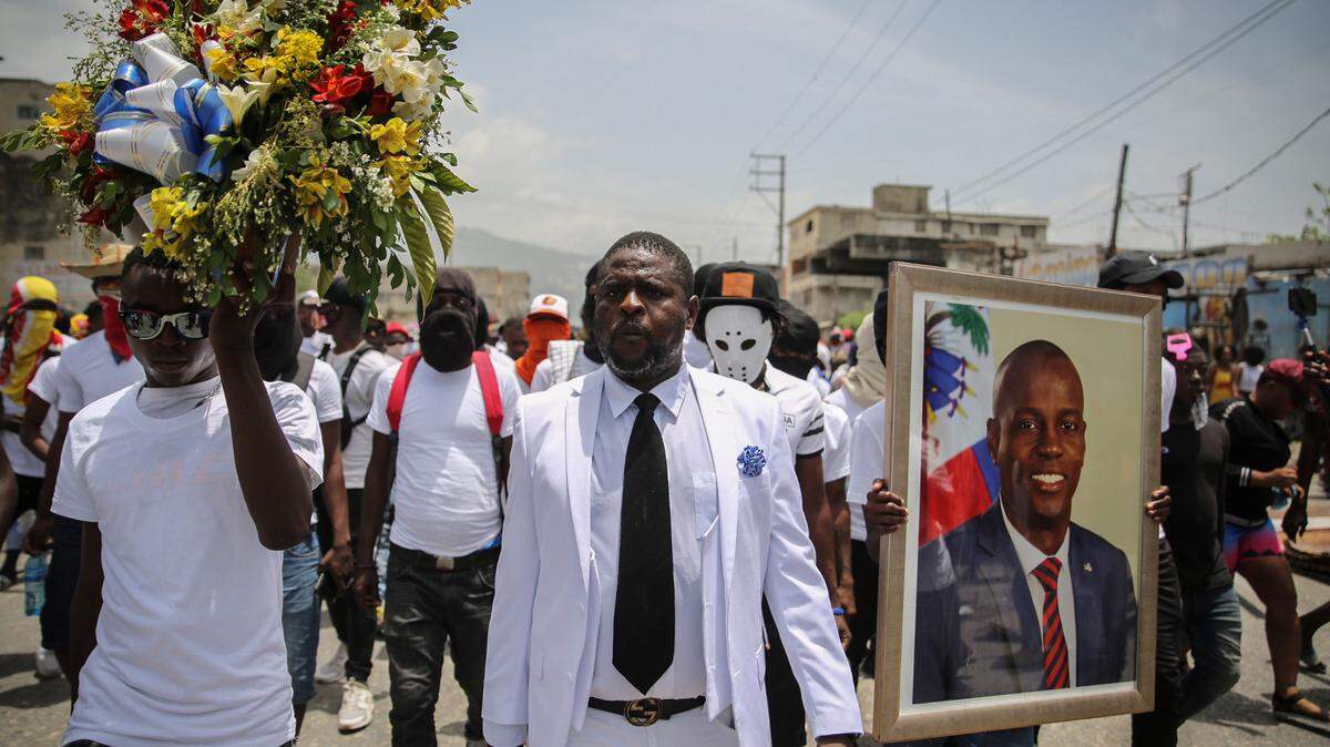 Jimmy Cherizier, alias Barbecue, a former police officer who heads a gang coalition known as “G9 Family and Allies,” marches during a rally to demand justice for slain Haitian President Jovenel Moise in Lower Delmas, a district of Port-au-Prince, Haiti, Monday, July 26, 2021. Moise was assassinated on July 7 at his home.
