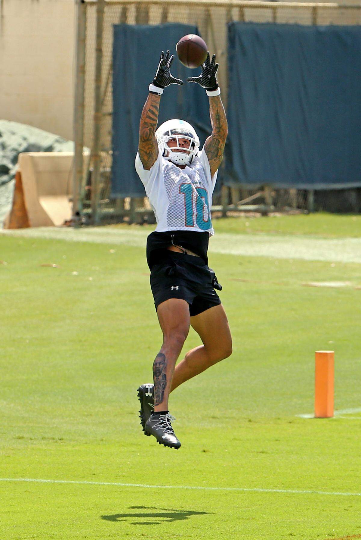 Miami Dolphins wide receiver Kenny Stills (10) catches a pass during the Miami Dolphins Organized Team Activities at the Baptist Health Training Facility at Nova Southeastern University on Thursday, May 21, 2019 in Davie.