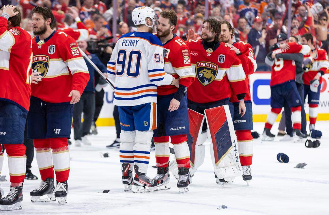 Florida Panthers left wing Matthew Tkachuk (19) hugs Edmonton Oilers right wing Corey Perry (90) after defeating the Oilers 2 to 1 in Game 7 of the Stanley Cup Final at Amerant Bank Arena on Monday, June 24, 2024, in Sunrise, Fla.
