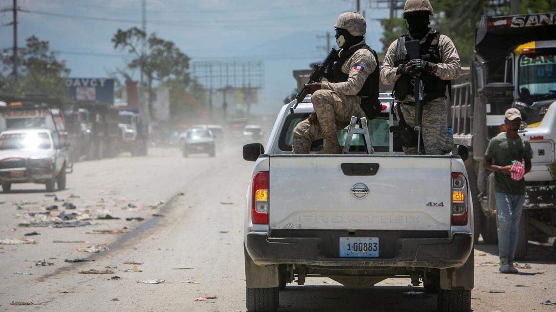 Port-au-Prince, June 23, 2022 - Policemen on Patrol keep their eyes on traffic during a stop at a police check point in Tabarre, near the U.S. Embassy.