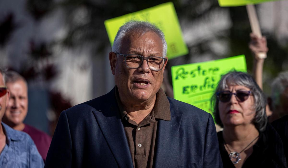 Dr. Hector Medina speaks to reporters in front of North Miami City Hall during a press conference. A lawsuit was filed seeking to force North Miami to hold its May 2023 elections. This comes months after the city council decided to move the date of the election and extend council members’ terms, which the lawsuit says is a violation of its charter. The mayor, Alix Desulme, and longtime councilman Scott Galvin are named in the lawsuit.
