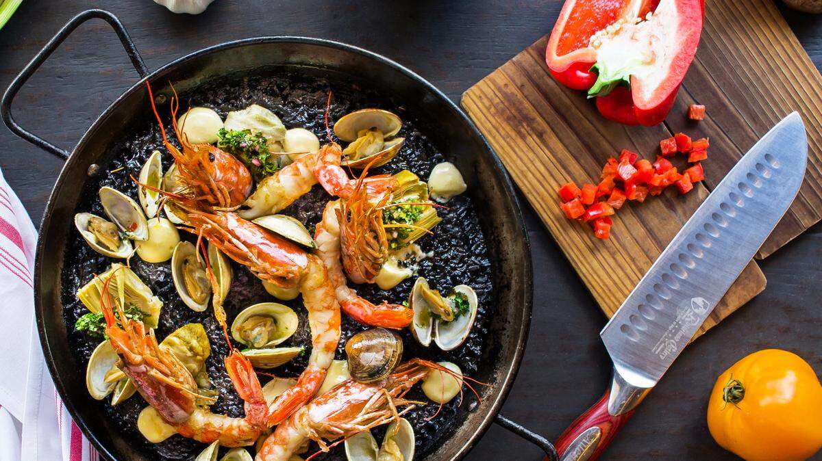 Share a large plate of paella negra and forget your troubles for awhile.