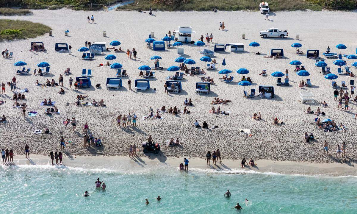 Beachgoers spend time on South Beach during spring break on Friday, March 14, 2025, in Miami Beach, Fla.