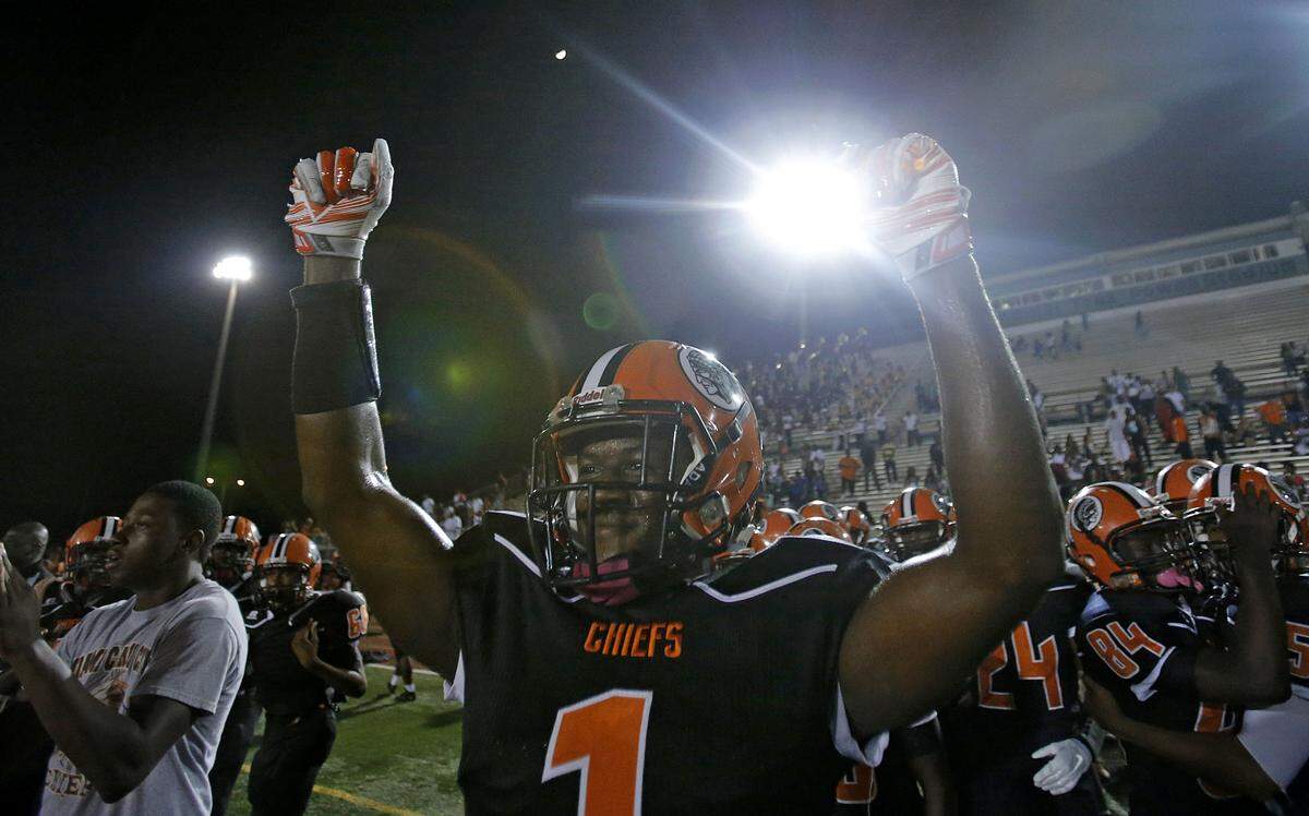 Carol City’s Rashad Fenton (#1) celebrates his teams victory over Norland in Miami on Thursday, October 30, 2014.