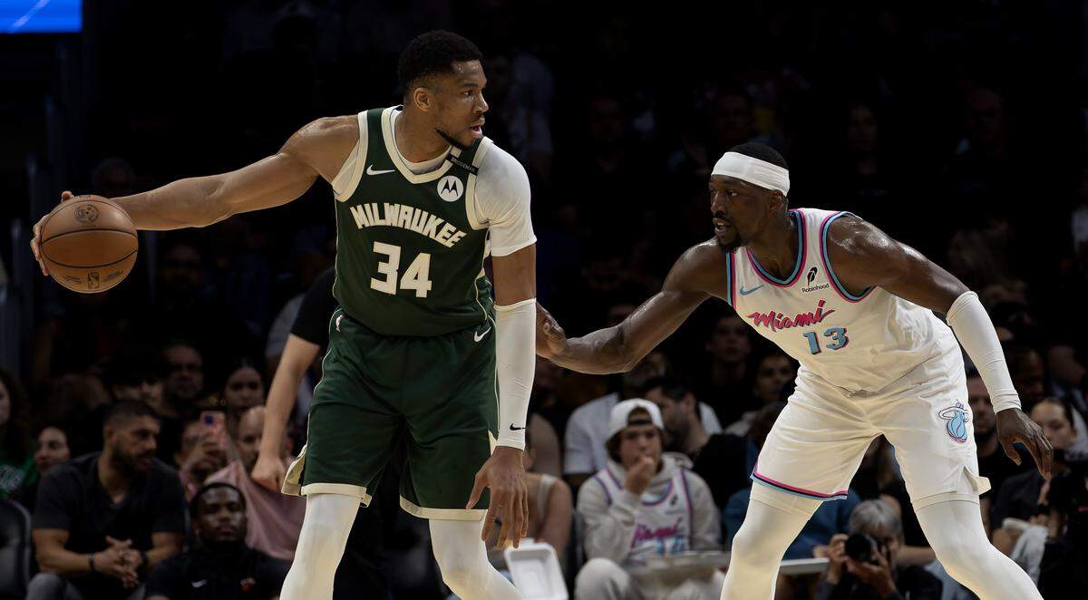 Miami Heat center Bam Adebayo (13) guards Milwaukee Bucks forward Giannis Antetokounmpo (34) during the first half of their matchup at Kaseya Center in Miami on April 5, 2025.
