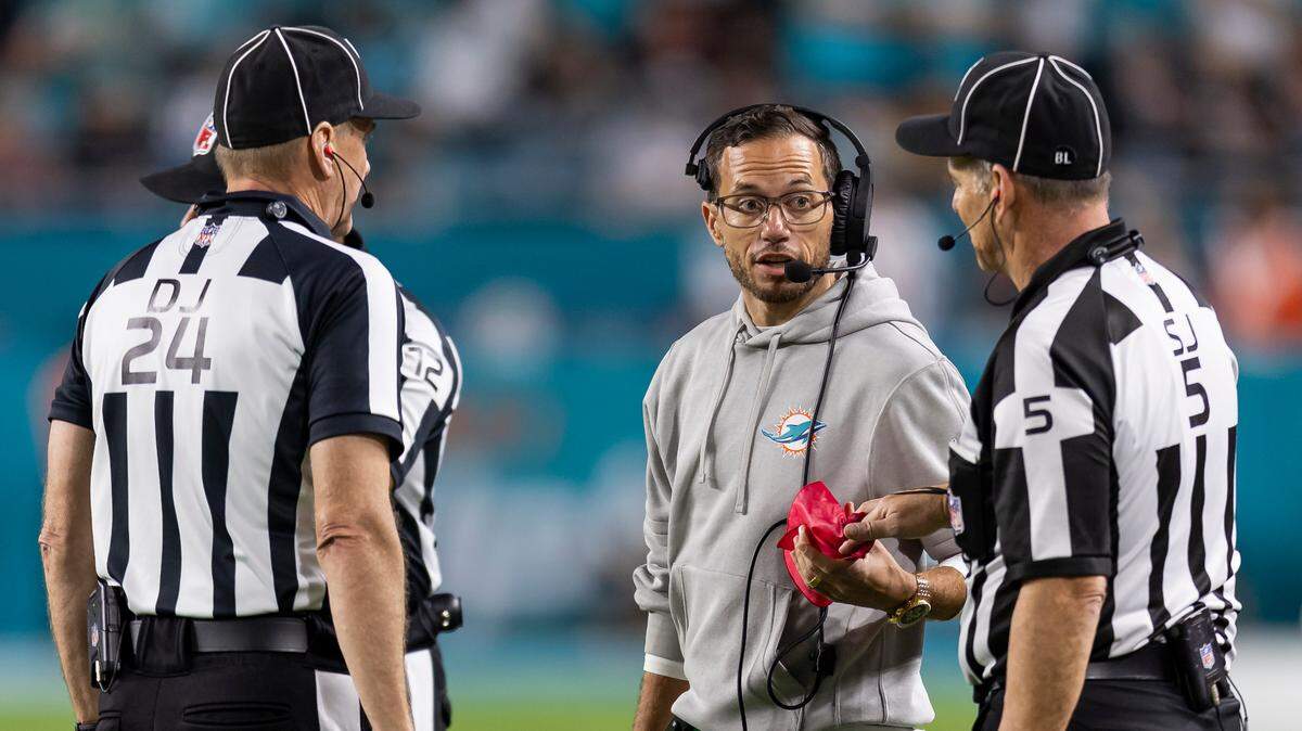 Miami Dolphins head coach Mike McDaniel talks with referees after a play in the third quarter of his NFL game against the Tennessee Titans at Hard Rock Stadium on Monday, Dec. 11, 2023, in Miami Gardens, Fla.