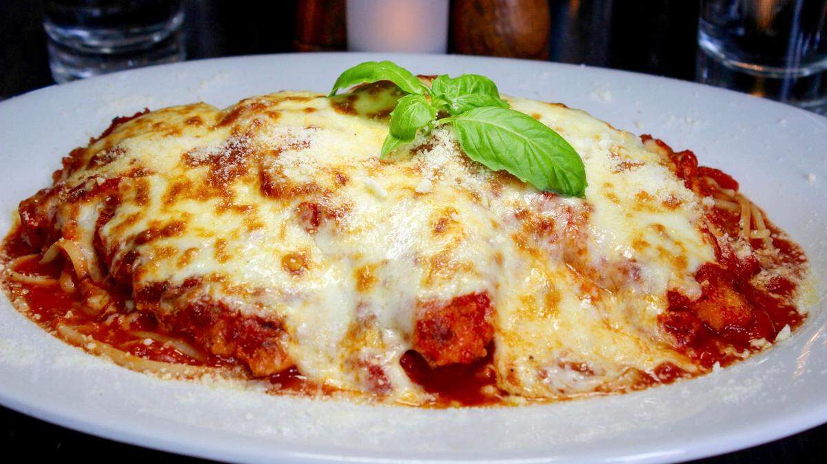 Objects in this photo may be larger than they appear: This is the chicken parm from Crust in Miami, which was named one of the best chicken parms in the country.