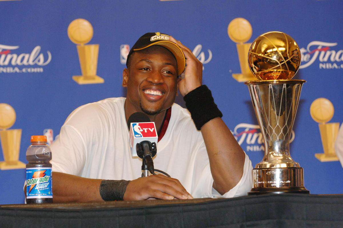 DALLAS - JUNE 20: Dwyane Wade #3 of the Miami Heat speaks to the media after winning the NBA Championship in Game Six of the 2006 NBA Finals on June 20, 2006 at the American Airlines Center in Dallas, Texas. NOTE TO USER: User expressly acknowledges and agrees that, by downloading and/or using this Photograph, user is consenting to the terms and conditions of the Getty Images License Agreement. Mandatory Copyright Notice: Copyright 2006 NBAE (Photo by Joe Murphy/NBAE via Getty Images)