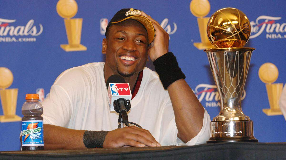 DALLAS - JUNE 20: Dwyane Wade #3 of the Miami Heat speaks to the media after winning the NBA Championship in Game Six of the 2006 NBA Finals on June 20, 2006 at the American Airlines Center in Dallas, Texas. NOTE TO USER: User expressly acknowledges and agrees that, by downloading and/or using this Photograph, user is consenting to the terms and conditions of the Getty Images License Agreement. Mandatory Copyright Notice: Copyright 2006 NBAE (Photo by Joe Murphy/NBAE via Getty Images)