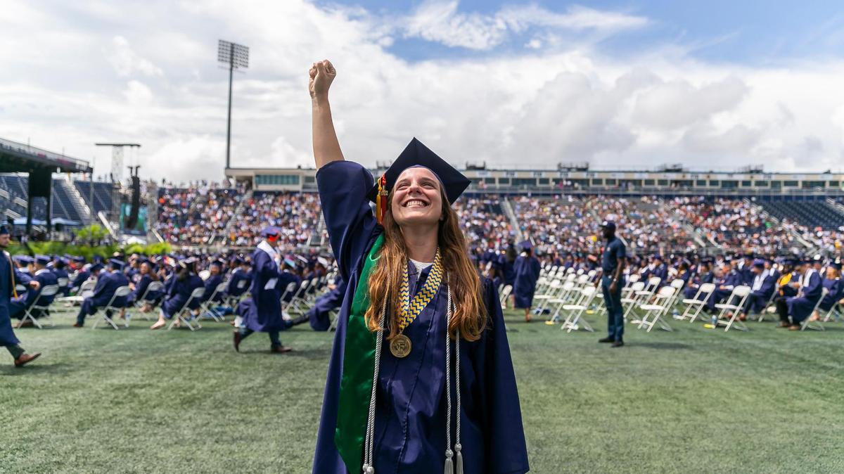 Florida International University student Beatriz Machado, 21, reacts during her graduation ceremony inside FIU’s Riccardo Silva Stadium in Miami, Florida on Saturday, April 30, 2022. Machado earned a bachelor’s degree in electrical engineering.